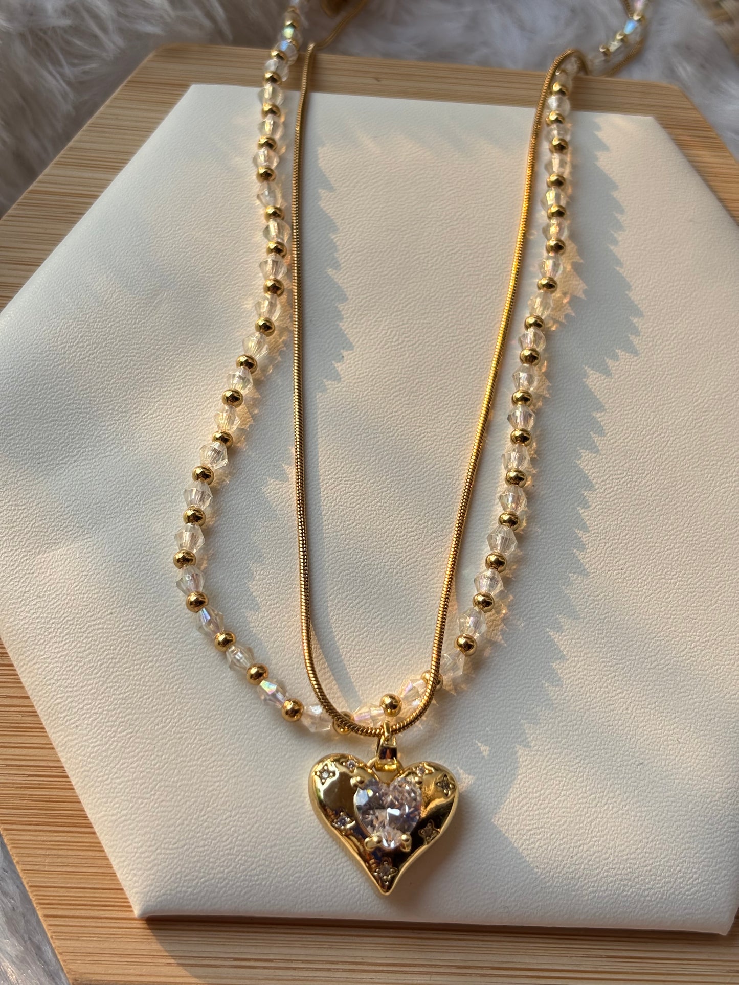 Heart pendent with shiny beads layer