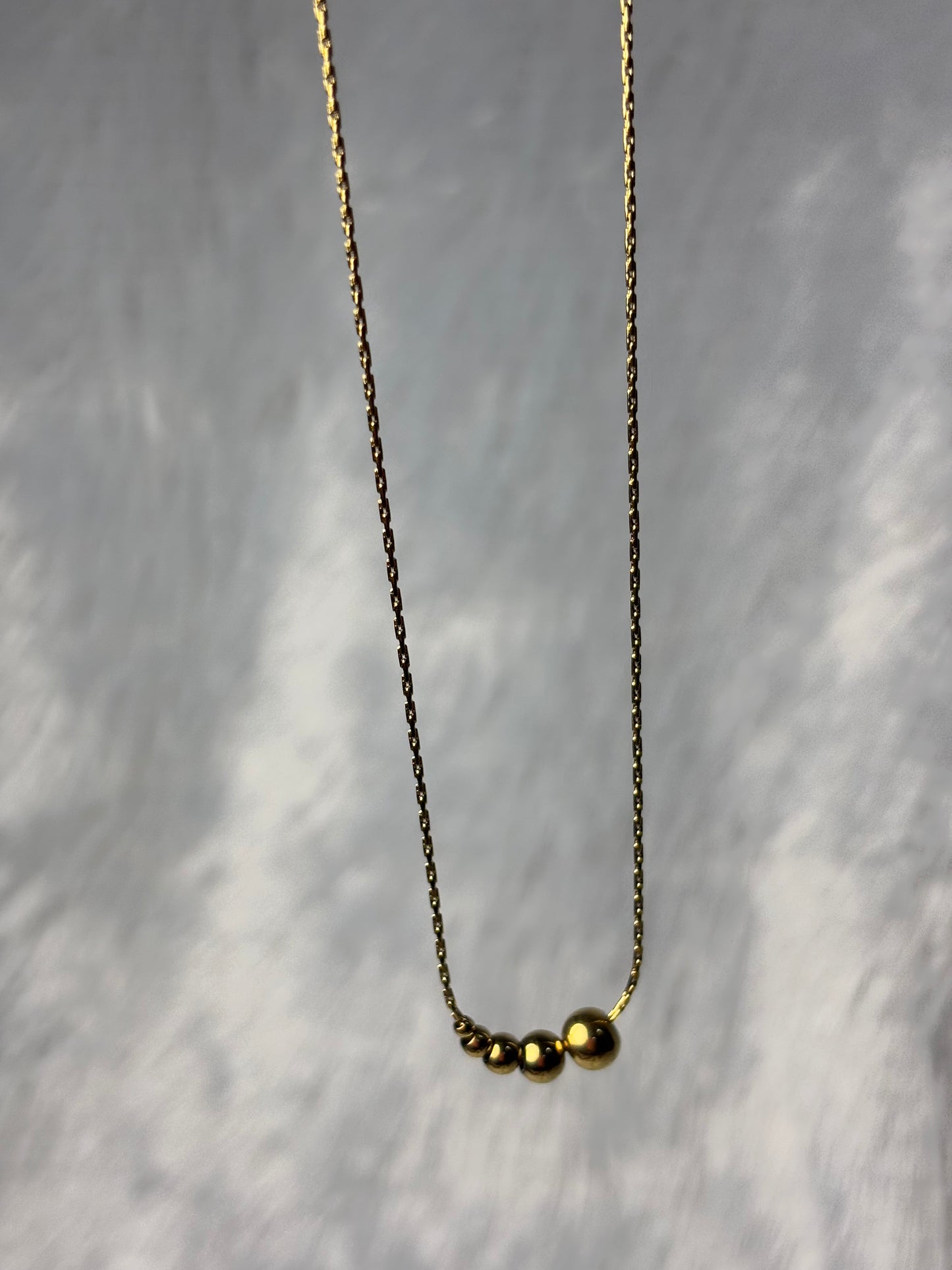 Gold beads pendent