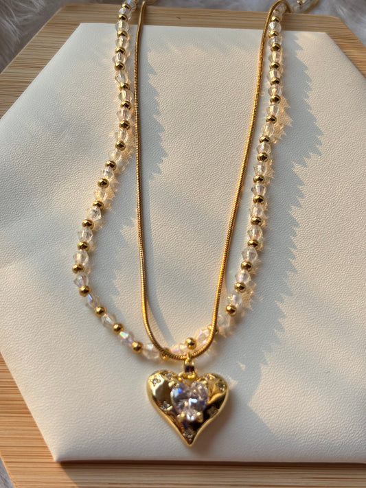 Heart pendent with shiny beads layer