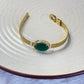 Bangle bracelet with green stone